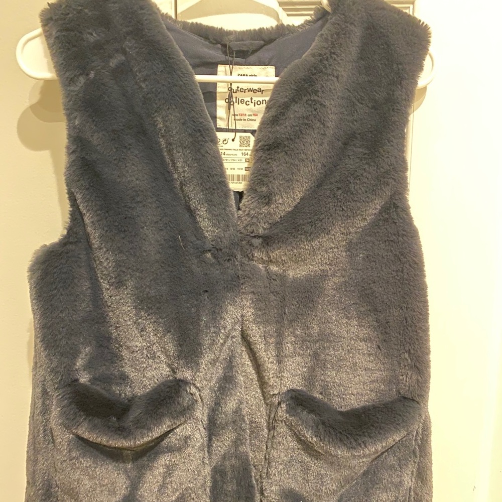 gray fluffy vest